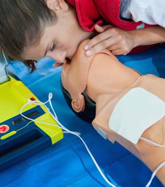 CPR training with defibrillatior on DPR doll